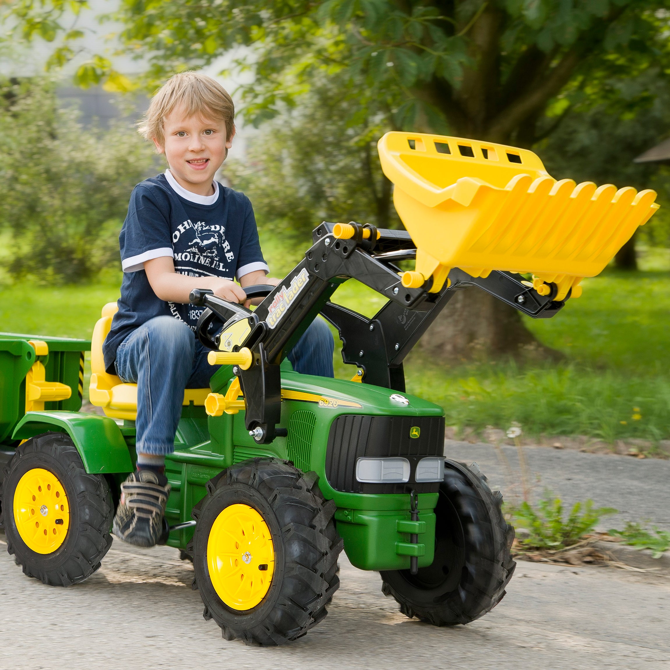 Let your child's imagination soar with the John Deere Farm Tractor. This impressive pedal powered ride on tractor comes complete with front loader that can be raised and lowered, scooped and tipped using the levers. The oversized rubber air tires are long lasting and provide a smooth ride.