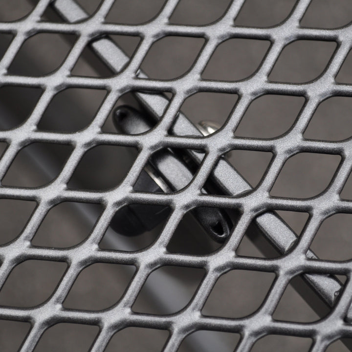 Close-up of iron grey 60-inch Round Mesh Top Table showcasing durable Electrotherm coating and steel mesh design.