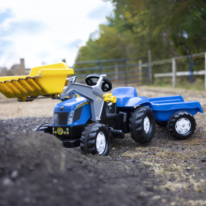 New Holland Front Load Kid Tractor w/Trailer pedal toy with working front loader and detachable trailer for kids aged 2.5+ years.
