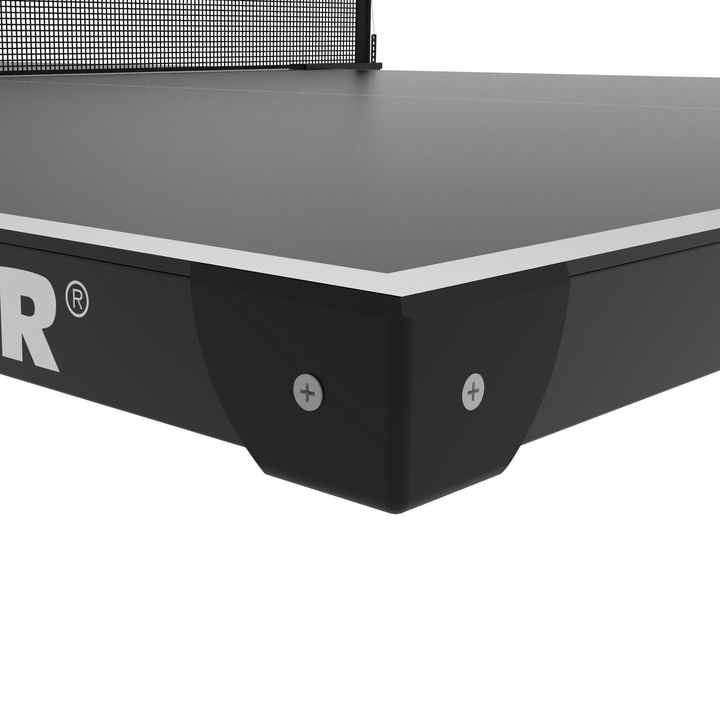 KETTLER Outdoor Conversion Top showing a black table tennis surface corner with silver trim and protective bracket