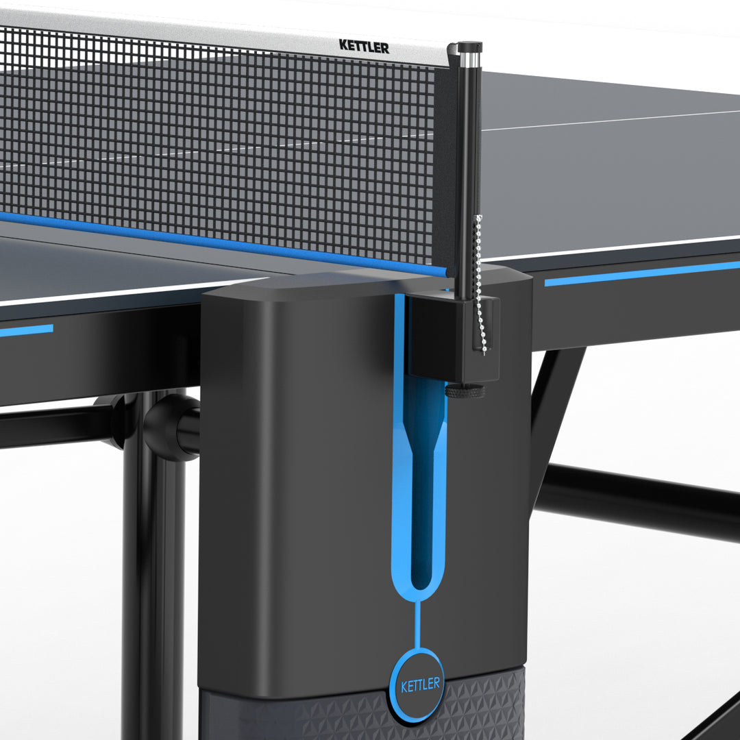 Close-up of Kettler table tennis net post and clamp on black and blue ping pong table edge