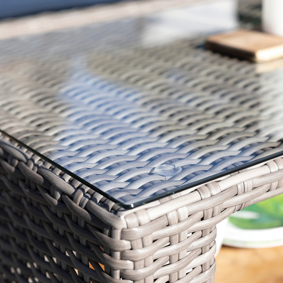 Palma Luxe Coffee Table close-up showing handwoven oyster weave and tempered glass top with storage shelf below.