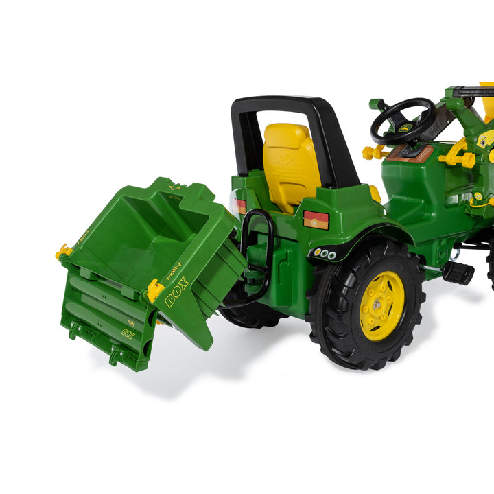 HaulBox Accessory for Tractors attached to green toy tractor with tiltable bed and detachable rear gate for kids play