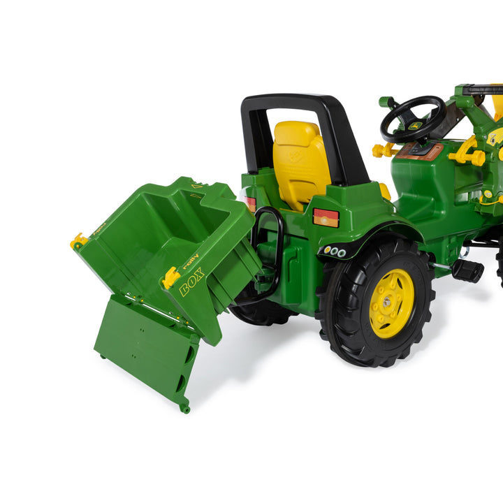 HaulBox Accessory for Tractors showing a green tiltable transport bed attached to a green toy tractor.