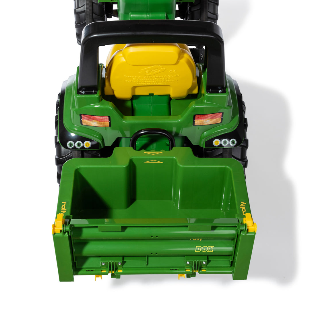 HaulBox Accessory for Tractors attached to green toy tractor with tiltable transport bed and detachable tailgate.