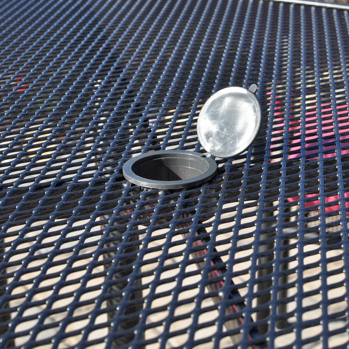 60-inch Round Mesh Top Table in iron grey with steel mesh top and umbrella plug for outdoor use.