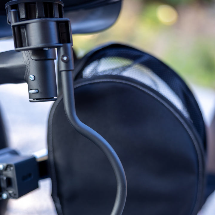 Close-up of black wheel and frame detail on KETTLER Air Navigator 6-in-1 Tricycle for toddlers.