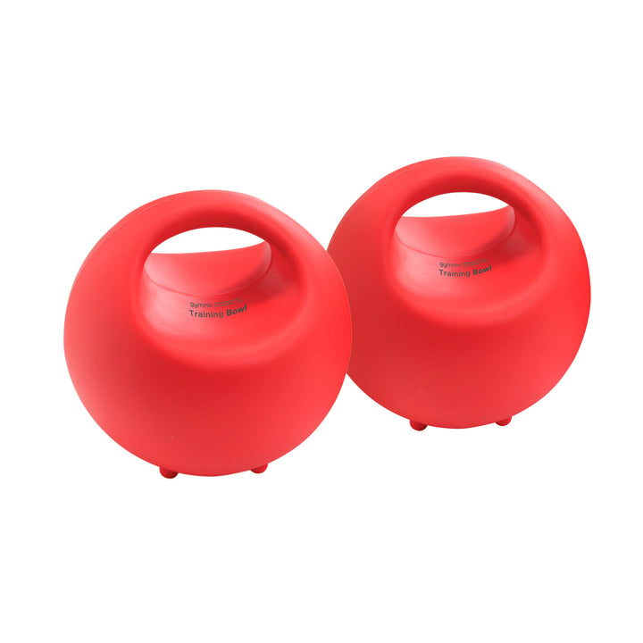 Two red training balls with handles on a white background