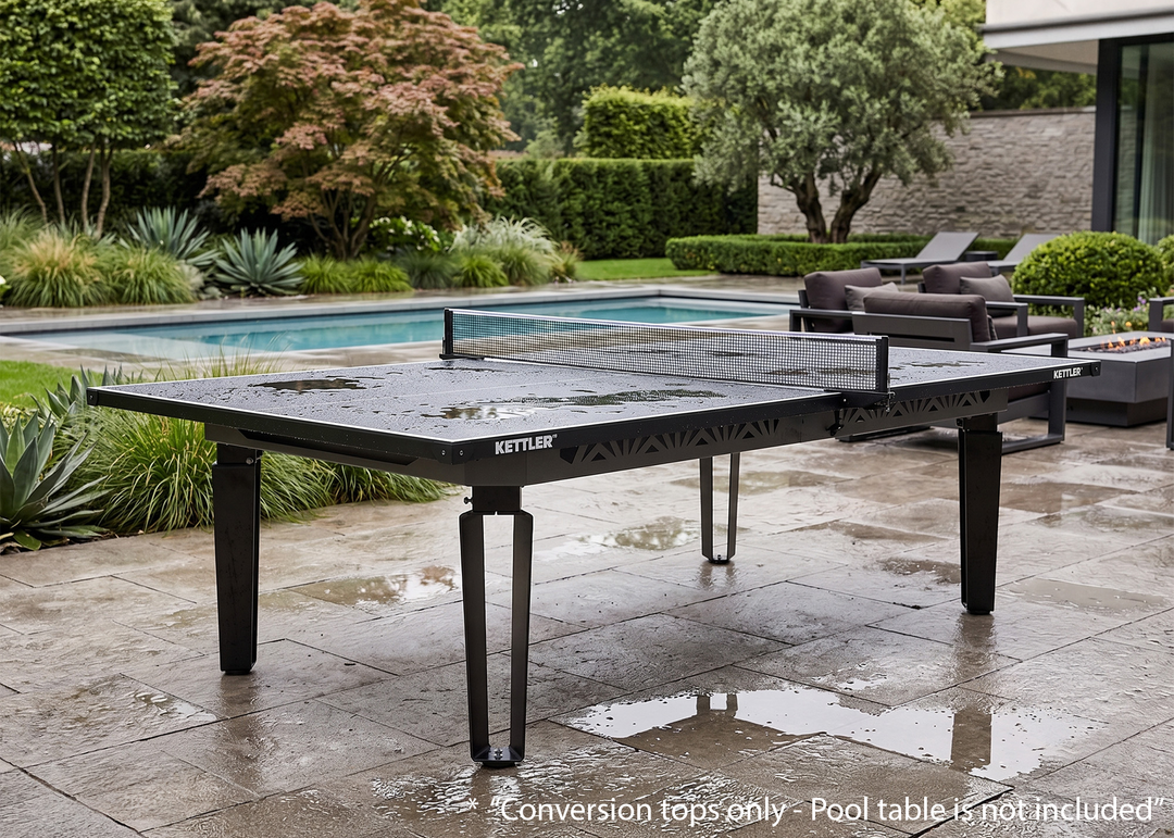 KETTLER Outdoor Conversion Top set up on a patio next to a pool with wet surface and modern garden furniture in the background