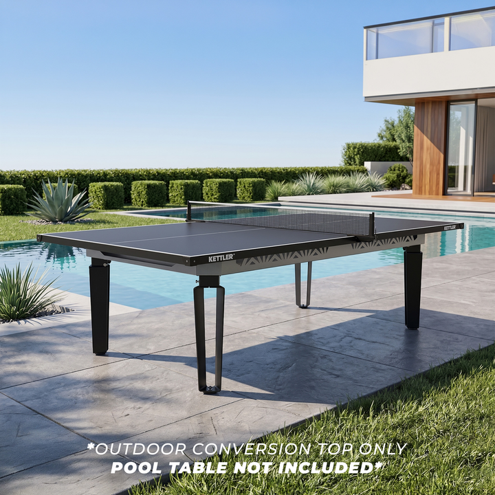 KETTLER Outdoor Conversion Top shown on a table tennis table beside a swimming pool in a modern backyard