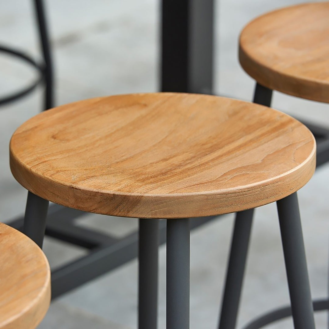 Canada Bar Stool with robust teak round seat and durable powder-coated aluminum frame in lava color, suitable for indoor or outdoor use.