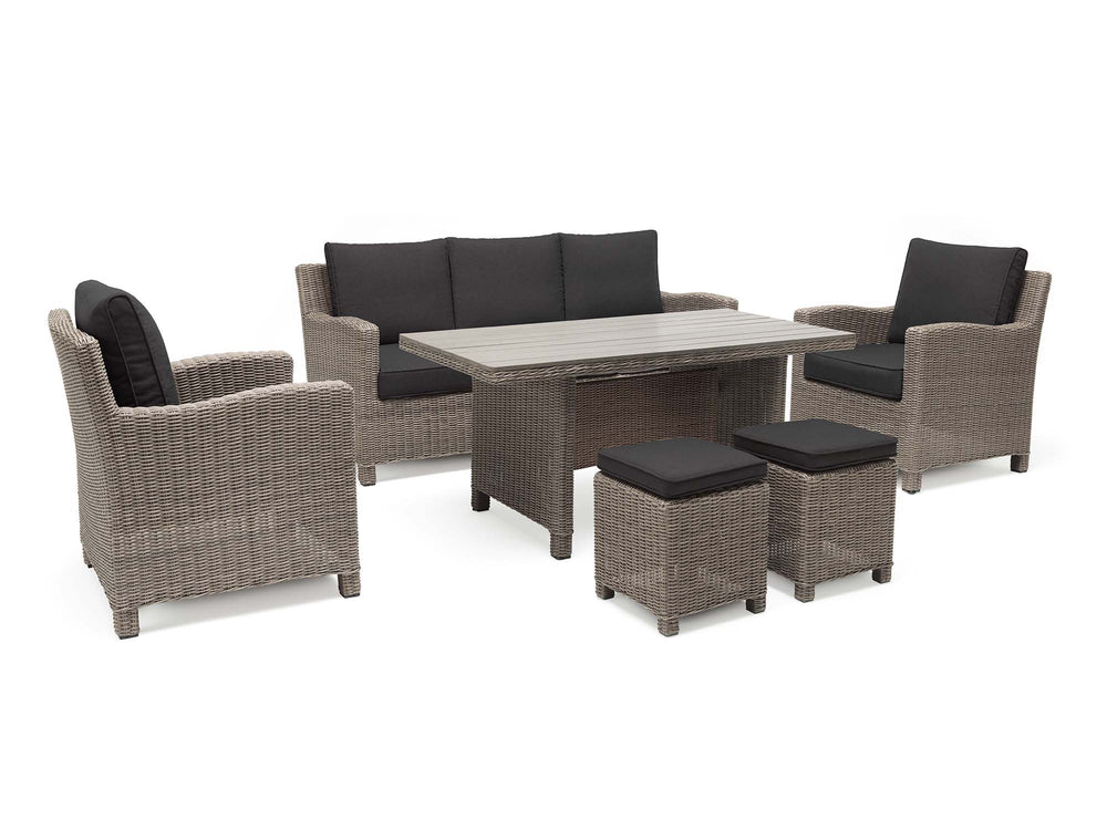 Palma Wicker Rattan Stool in grey wicker with black cushions paired with matching sofa, chairs, and table set.