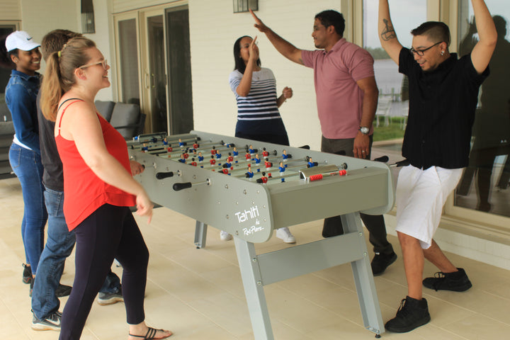 6 player kicker table lifestyle shot on patio