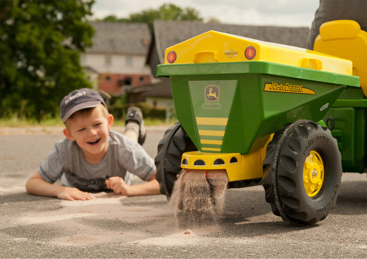 John Deere Tow Behind Spreader Accessory spreading material with chain driven mechanism on large Rolly tractor toy.
