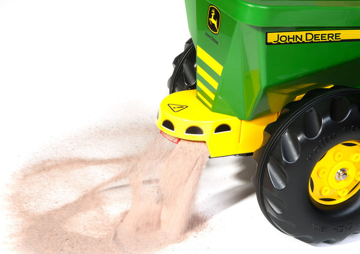 John Deere Tow Behind Spreader Accessory showing resin wipe clean rotating spreader disc in action on white background