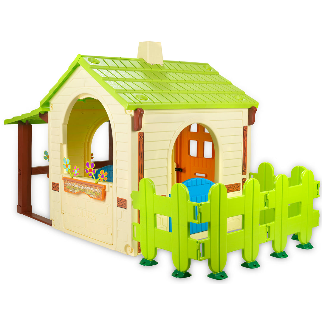 Country Playhouse large country-style playhouse with green roof, doors, fence, and flower boxes for kids' outdoor fun.