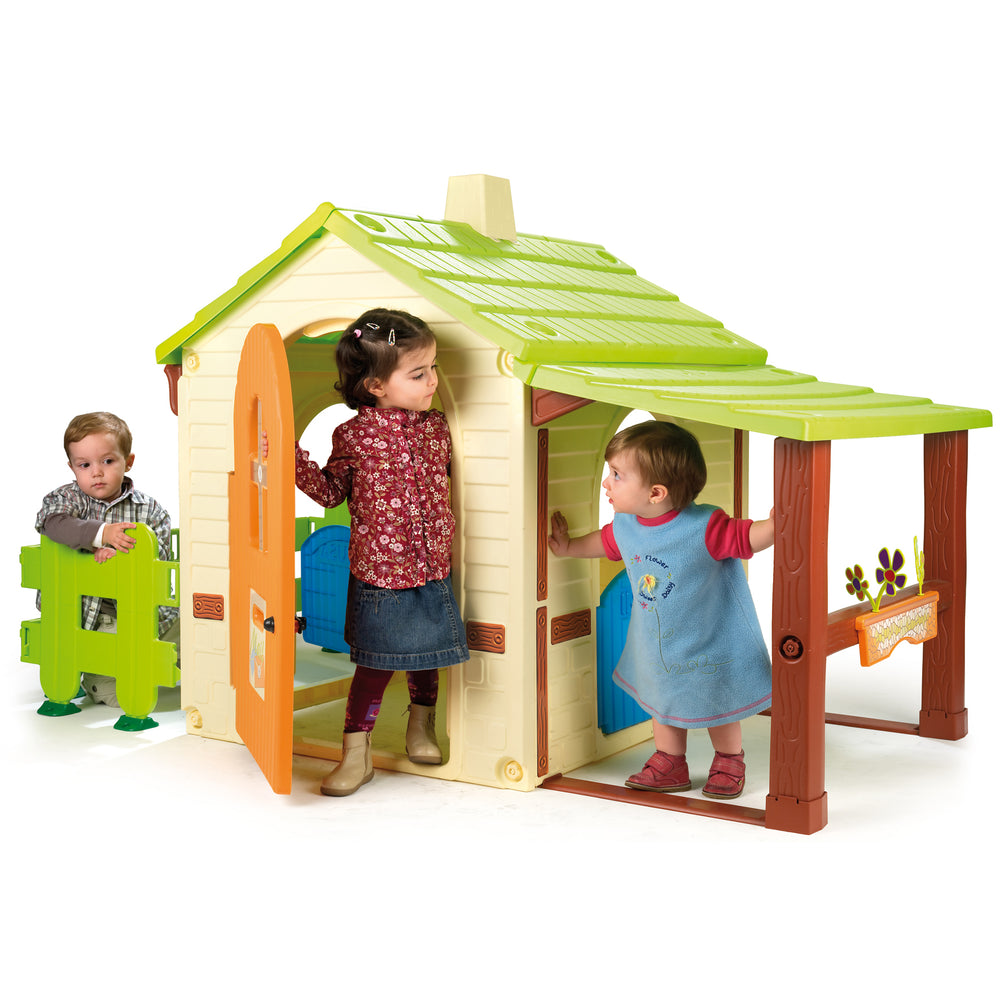 Country Playhouse & Gyffy The Giraffe Bounce Toy Set with kids playing in a large yellow and green playhouse.