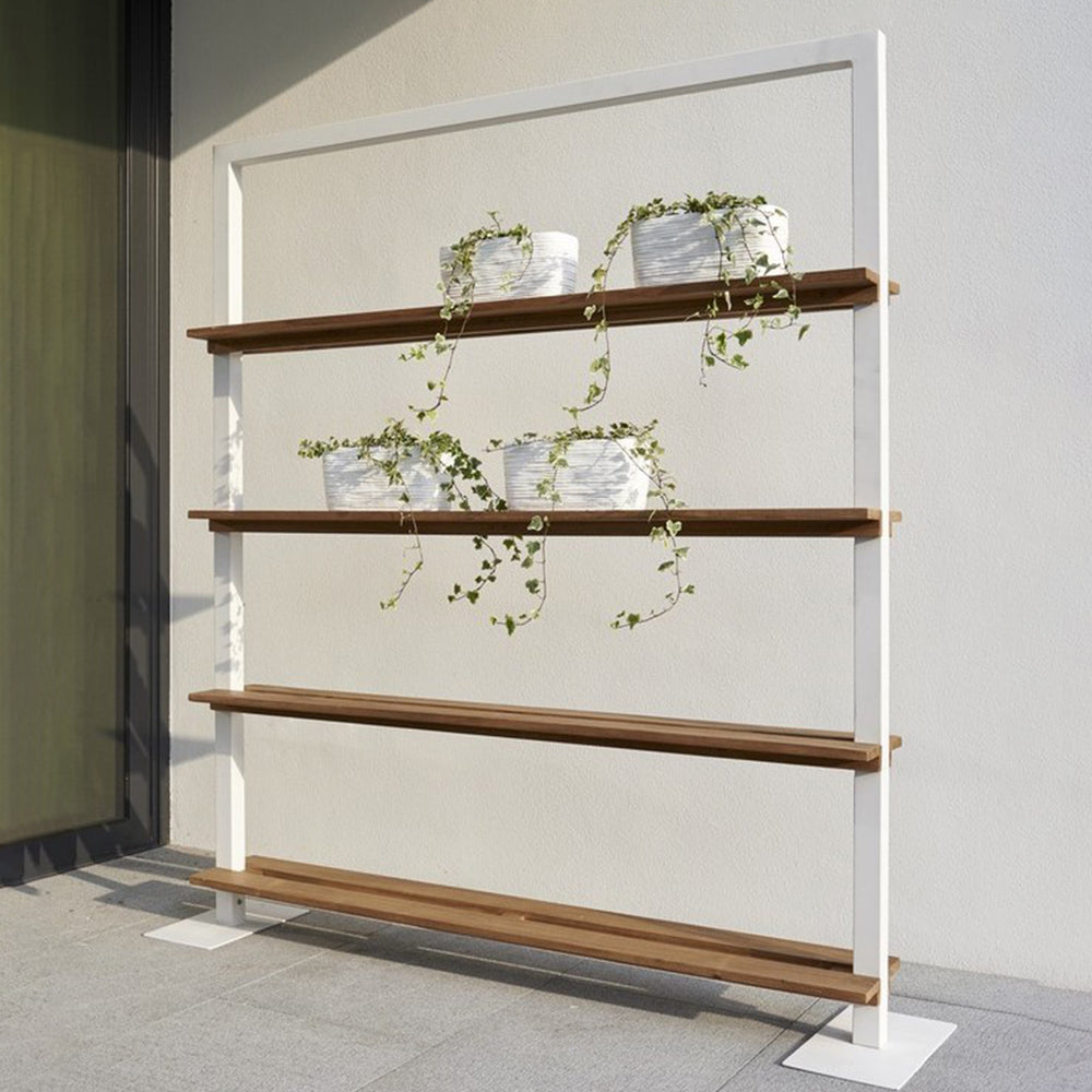 Nevada Patio Room Dividers with white aluminum frame and teak shelves holding potted plants outdoors.