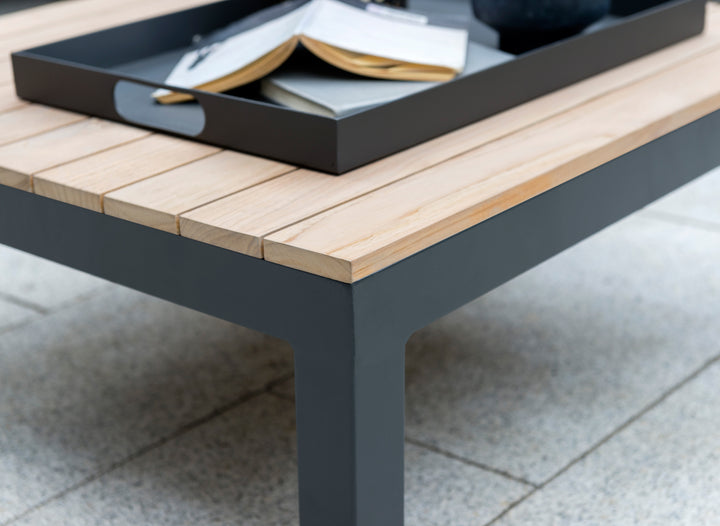 Elba Powder Coated Aluminum Serving Tray in charcoal on outdoor table holding an open book and papers.