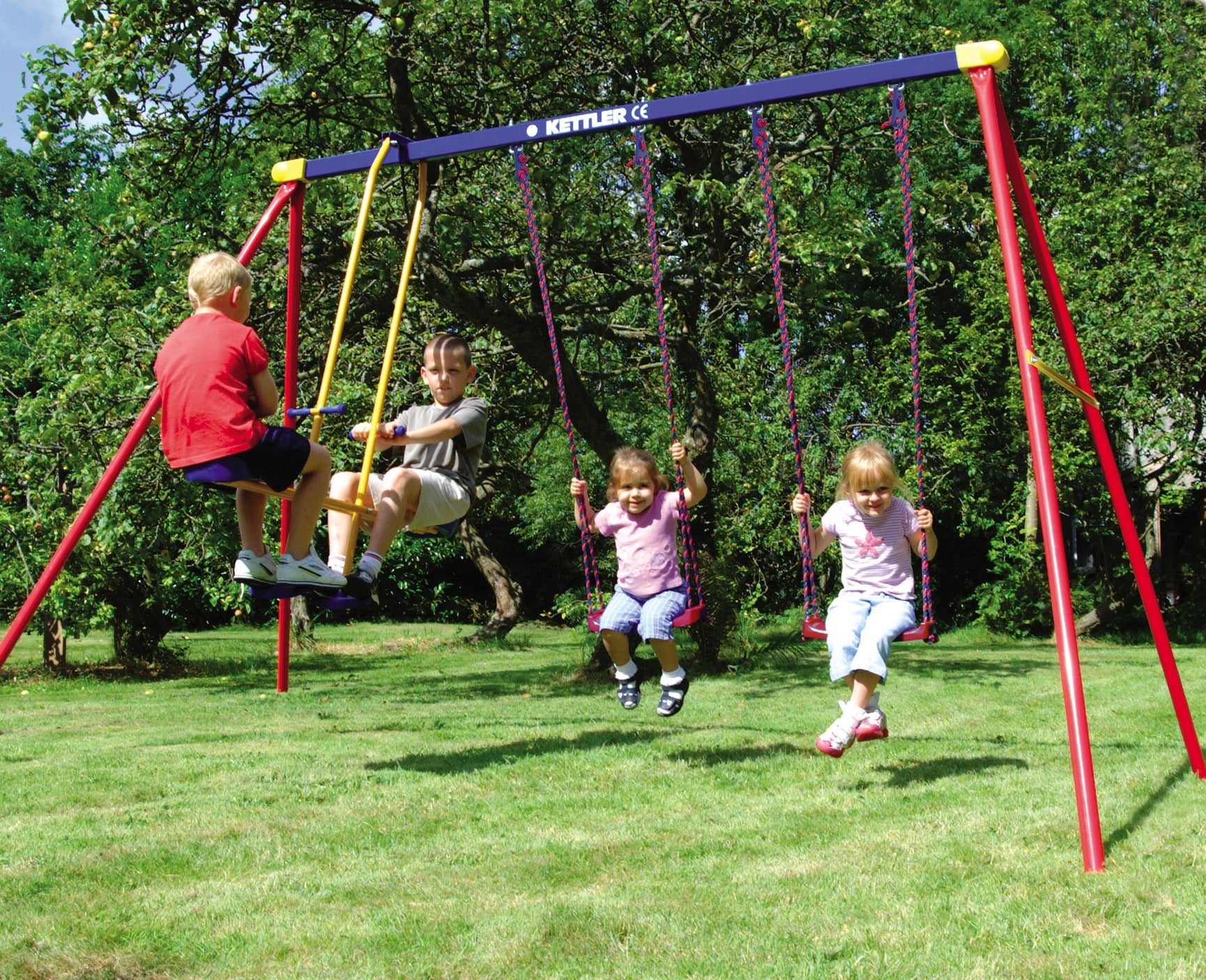 Children playing on the KETTLER Multi-Play Swingset Bundle