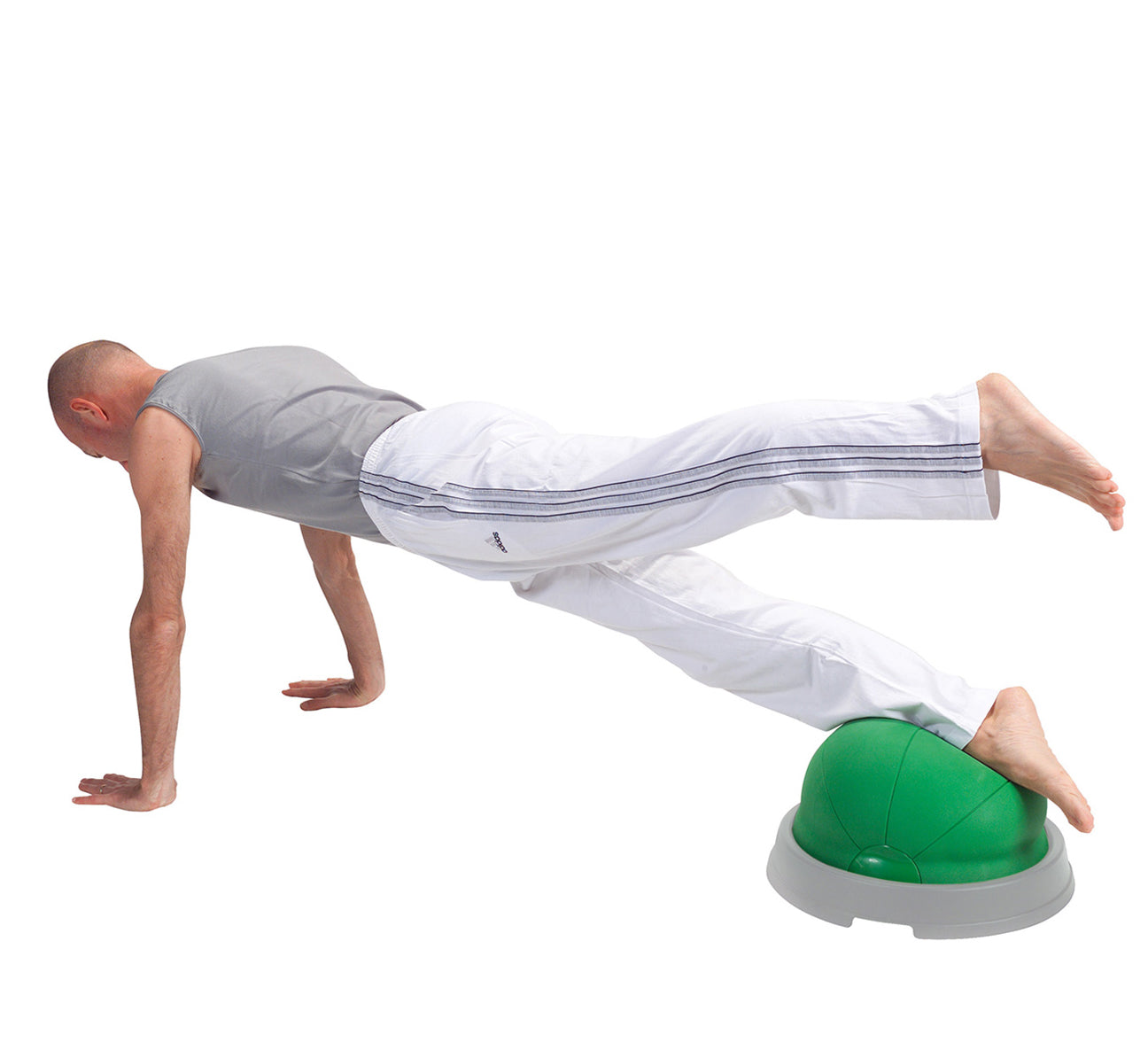 The Core Balance is a multi-functional tool, which is suitable for different kinds of training: from fitness to post-injury knee and ankle rehab. It is a soft green inflatable half ball with a hard base. You can inflate the product to the needed stability level. Useful aid to improve balance and coordination, it is also recommendable for stretching, flexibility and stabilization exercises.