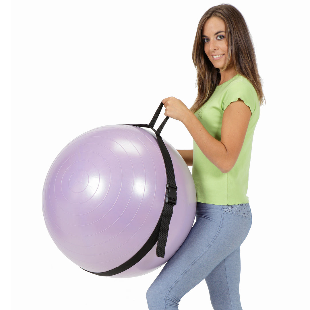 Woman holding a purple fitness ball using the Gymnic Fitness Ball Carry Strap for easy transport.