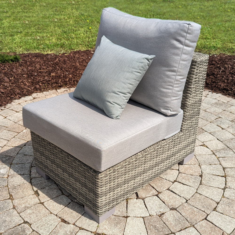 Aya Wicker 4-Piece Corner Sectional With Cushions grey woven wicker armless outdoor chair on stone patio