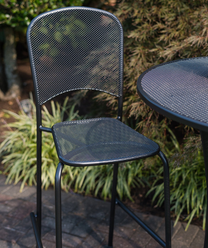 Carlo Stackable Bar Chair in iron grey metal mesh with ergonomic design and integrated footrest for outdoor seating.