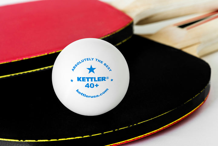 1-Star Table Tennis Balls 6-Pack showing a white ball with Kettler logo near red and black paddles.