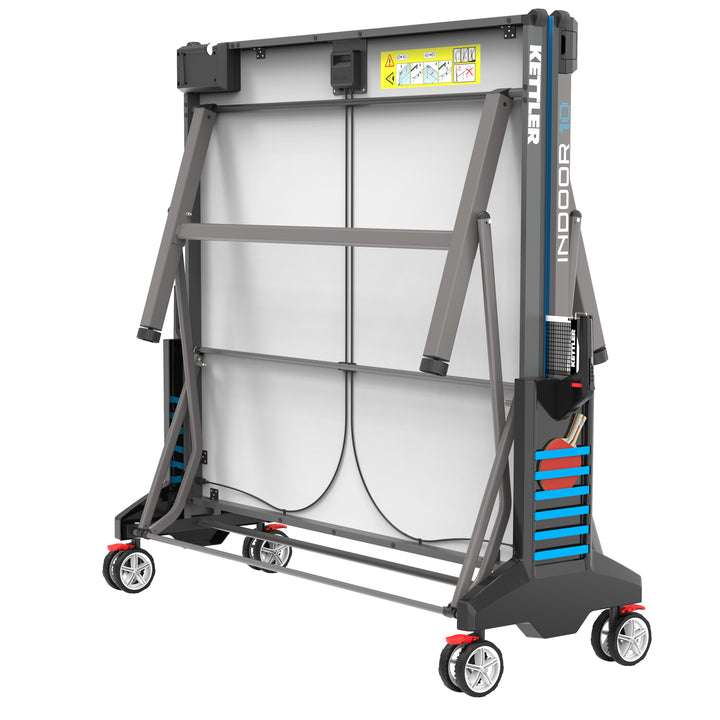 Indoor 10 Table Tennis Table folded for compact storage with wheels and patented ball dispensers visible.