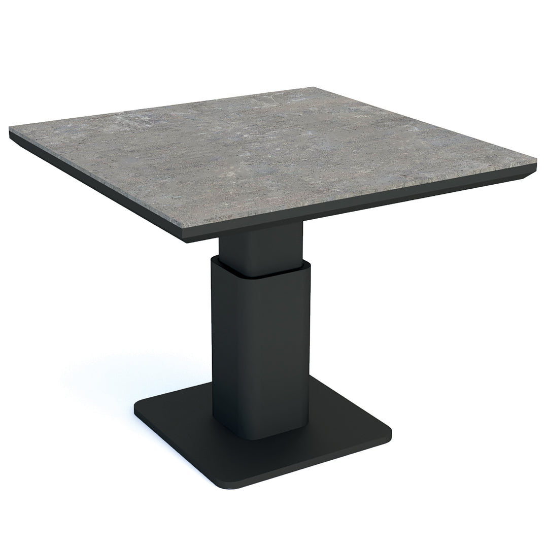 LUKA Adjustable Height Table with concrete look ceramic top and lava powder-coated aluminum frame, adjustable from 19 to 29 inches.