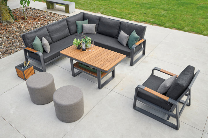 Montana Right Sofa outdoor set with charcoal cushions, teak accents, and powder-coated aluminum frame on patio.