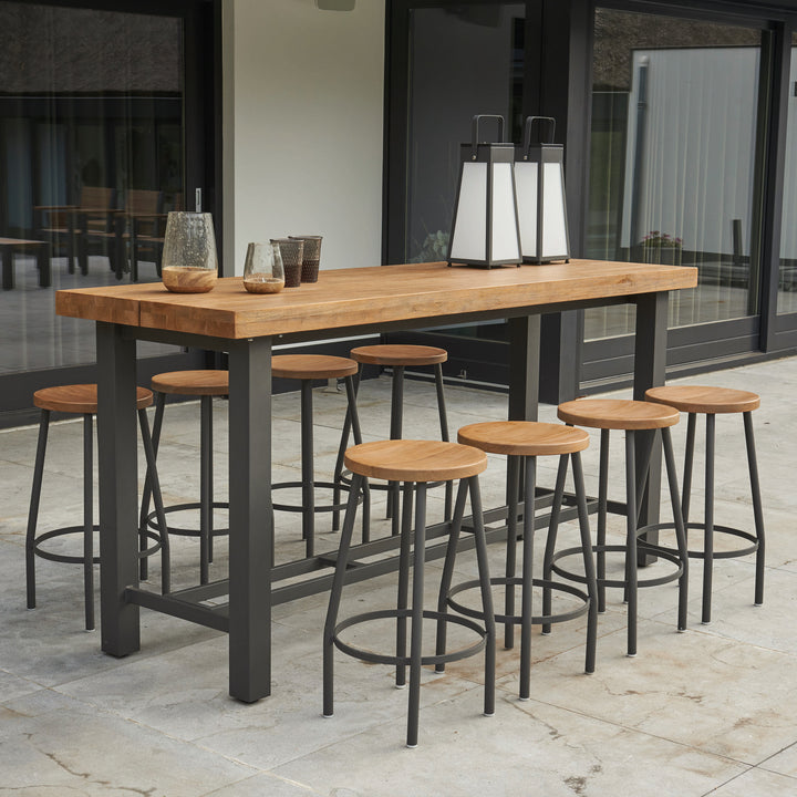 Canada Bar Height Dining Set with teak top and lava aluminum frame, includes eight stools and a tall bar table.
