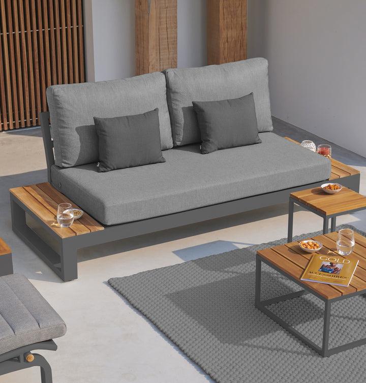 Soho Loveseat Bench With Side Tables in lava frame with steel cushions and teak end tables in modern outdoor setting