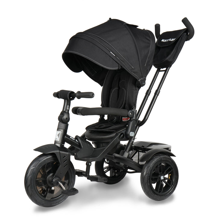KETTLER Air Navigator 6-in-1 Tricycle in black with adjustable canopy, parent handle, and safety harness.