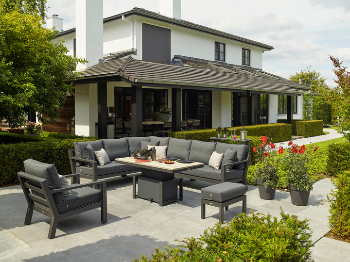 Timber Armless Chair in charcoal with modern outdoor setting, powder-coated aluminum frame and weather-resistant cushions.